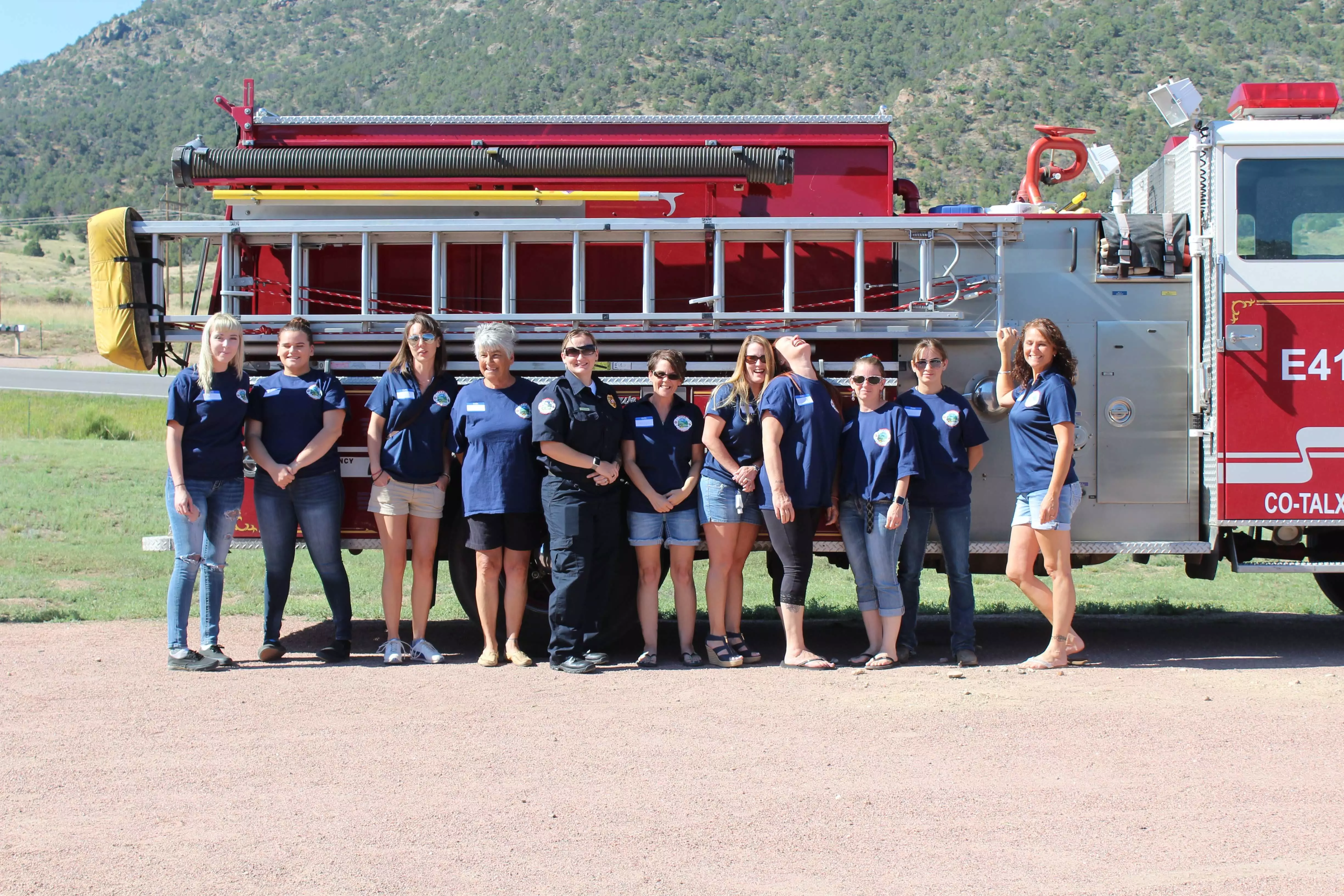 Auxiliary Committee in front of fire truck