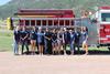 Auxiliary Committee in front of fire truck